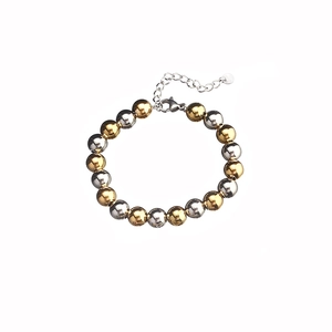 Detail of mixed gold and silver stainless steel beaded bracelet with lobster clasp