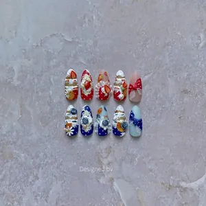 3D dessert themed press-on nails with handmade cream textures and strawberry charms