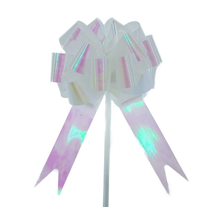 Macro view of a 3D spherical white holographic pull bow for gift packaging
