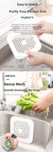 Detailed view of white silicone sink strainer with suction cups and drainage holes