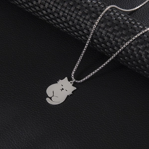 Cute minimalist silver cat pendant necklace with sleek box chain on premium black background
