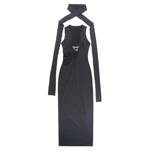 Detail view of black backless dress showing metal ring buckle and long ribbon necktie accessory