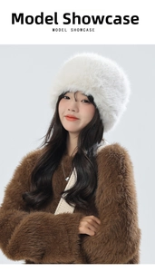 Close-up of white plush thermal earflap hat featuring fluffy faux fur and soft texture