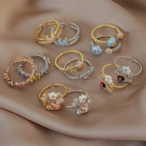 Colorful macaron enamel open rings with zircon heart and flower designs on champagne satin