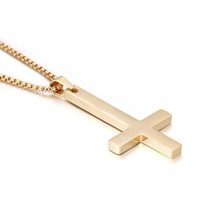 Polished gold titanium steel inverted cross pendant necklace for men on white background