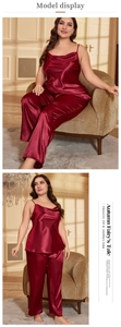 Detail view of burgundy satin sleepwear set with silk texture and elegant camisole pants