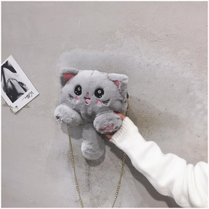 Detail of grey plush kitten crossbody bag with pink paw embroidery and gold chain strap