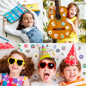 Colorful birthday stickers on a laptop and guitar showing creative party decorations