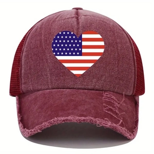 Close-up of distressed brim and printed heart USA flag on burgundy baseball cap