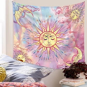 Bedroom wall decor detail showing bohemian sun and moon tapestry in pink purple hues