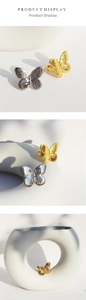 Macro shot of 3D butterfly open rings in gold and silver finish with radial textures