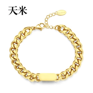 Detailed shot of golden stainless steel Cuban link ID bracelet with customizable plate