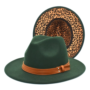Detail of green wool jazz hat showing brown leather band and orange leopard print lining