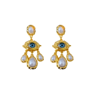 Vintage eye-shaped gold earrings with blue center and dangling teardrop pearls