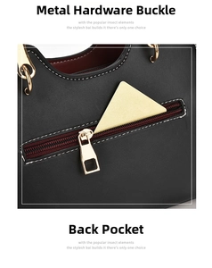 Detail of black leather handbag featuring golden hardware hooks and a back zipper pocket