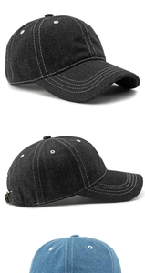 Detailed view of black and blue baseball caps with contrasting white stitching accents