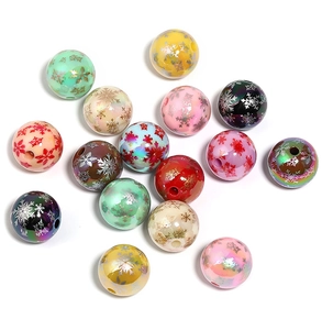 Colorful Christmas acrylic round beads with snowflake and maple leaf patterns for DIY crafts