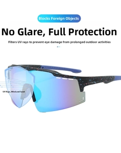 Detail of cycling glasses with black splatter frame and purple-blue gradient mirror lens