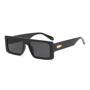 Chic black square frame sunglasses with golden rocket hardware on the temple arm