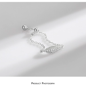 Close-up of S925 sterling silver feather ring with zircons and delicate chain detail