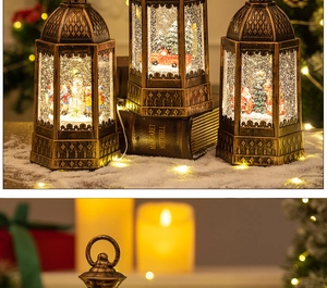 Detail of vintage bronze Christmas snow globe lanterns with warm LED lighting and glitter