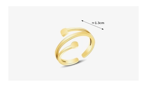 Detail view of a 1.3cm wide double-layered gold ring with geometric shapes on white base