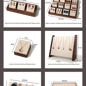 Detailed view of walnut wood and beige velvet jewelry display set with exact dimensions