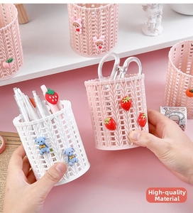Detailed view of woven texture pen holder with cute cartoon bear and rabbit icons