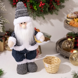 Standing Nordic Santa Claus plush doll with blue and grey outfit in a festive setting