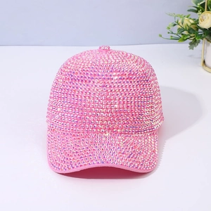 Fashionable pink rhinestone baseball cap with sparkling crystals for women on white background
