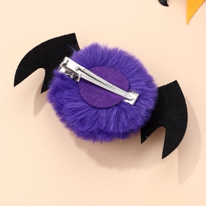 Back view of purple plush bat hair clip with black felt wings and silver metal duckbill clip