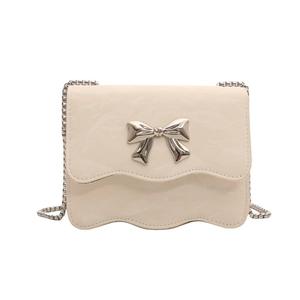 Elegant cream chain crossbody bag with pleated texture and silver bow detail