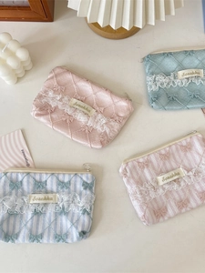 Floral lace coin purses in assorted pastel colors with bow knots and zipper closures