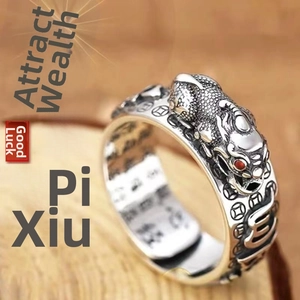 Macro shot of retro Pixiu ring detailing inner Heart Sutra scripture engravings