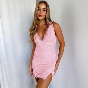 Close-up of pink lace mini dress with deep V-neck and delicate floral embroidery details