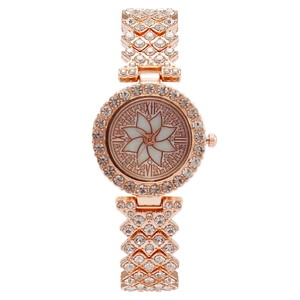 Luxurious rose gold women's watch with rhinestone flower dial and crystal paved bracelet