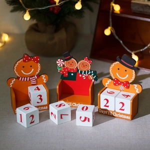 Wooden gingerbread man Christmas countdown calendar with blocks and festive background