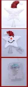 Detail of Christmas tree topper star with snowman design and 9-mode battery light controller