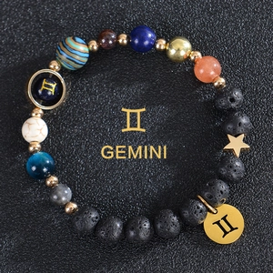 Detail of Gemini planetary bracelet with black lava rock and natural stone beads