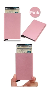 Detailed view of pink aluminum RFID card holder with automatic slide pop-up mechanism