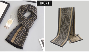 Macro detail of wool blend scarf featuring interlocking geometric pattern and fringe trim