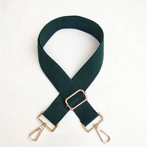 Adjustable dark green canvas bag strap with durable gold metal swivel hooks and buckles