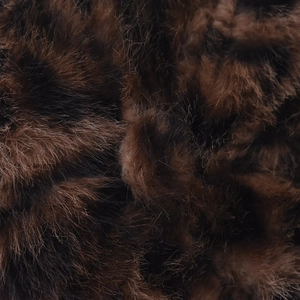 Macro detail of faux fox fur baseball cap featuring a soft leopard print texture