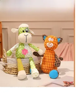 Detail of plush animal toys featuring multi-textured corduroy and polka dot patchwork