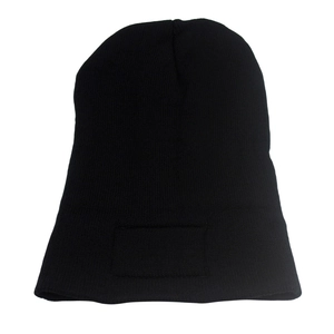Detailed close-up of a black knitted beanie featuring a rectangular logo patch area