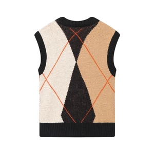 Diamond pattern knit vest vest in black, white and beige with orange accents on white background