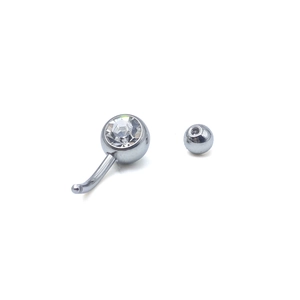 Minimalist stainless steel navel ring with sparkling clear gemstones on white background