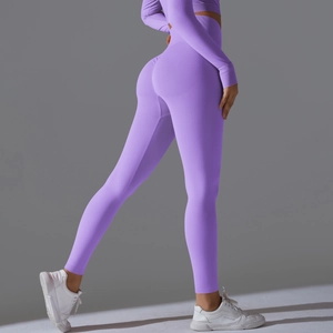 Detail view of seamless purple yoga set with high waist leggings and long sleeve crop top
