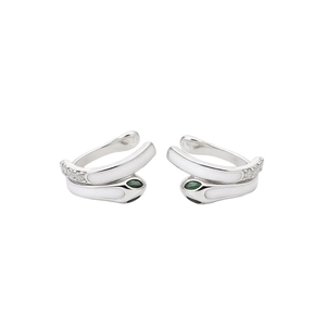Silver snake ear cuff with green gems and white enamel in a minimalist luxury style