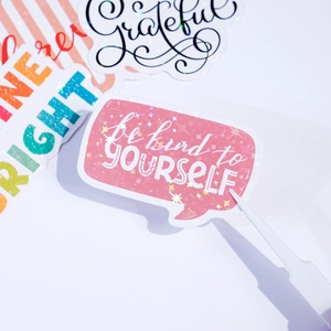 Macro shot of laser holographic inspirational stickers with star effects and rainbow colors